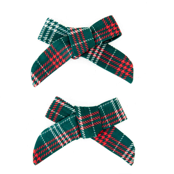 Pair of green and red plaid pigtail bows. 