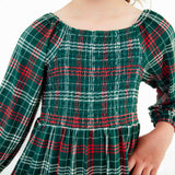 Close-up of holiday plaid smocked dress.