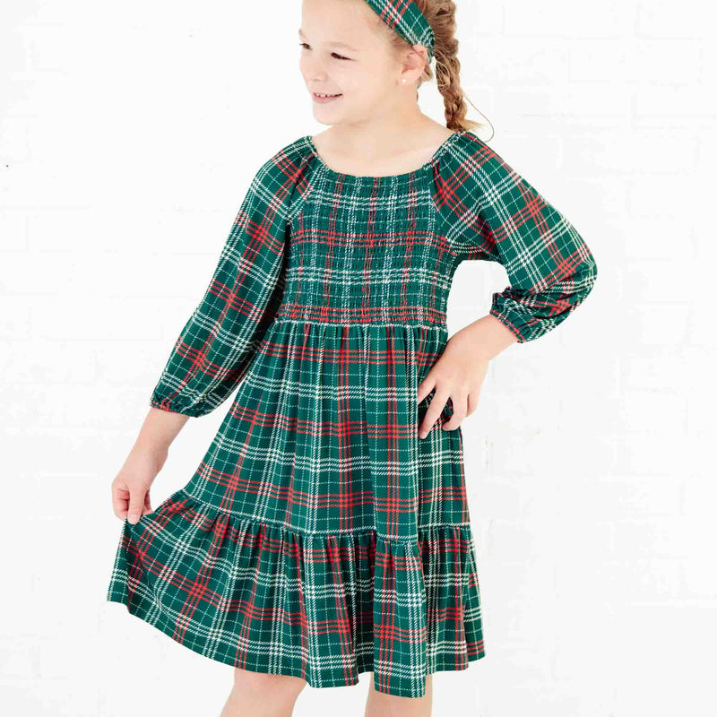 Girl smiling in a holiday dress. 