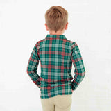 Boy in a green plaid polo shirt. 