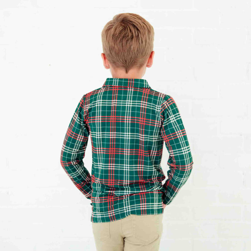 Boy in a green plaid polo shirt. 