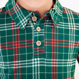 Close-up of a green plaid polo shirt collar. 