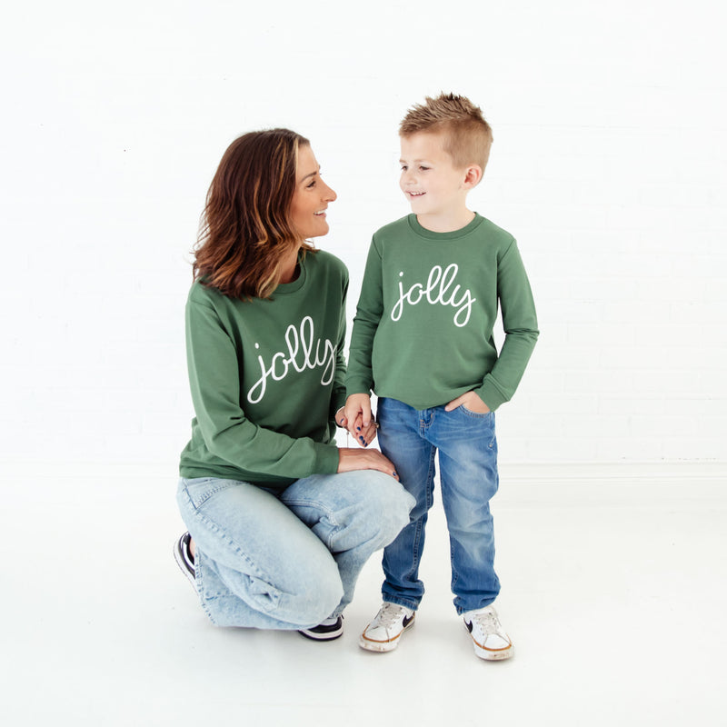 Mom and child in matching Jolly sweatshirts. 