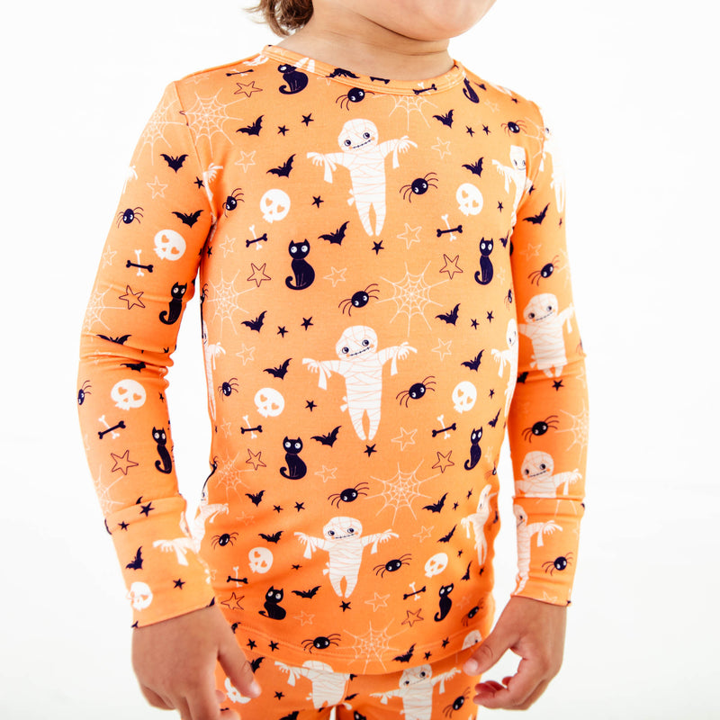 Mummys and cat print on halloween pajamas.