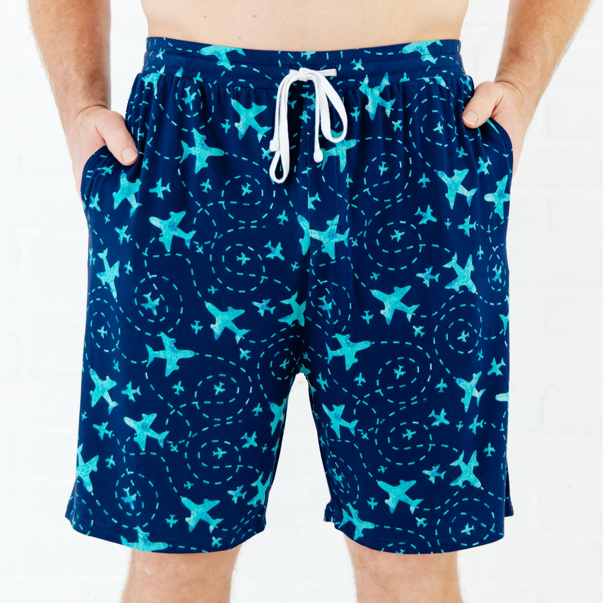 Men’s lounge shorts with navy airplane print from Dreamiere