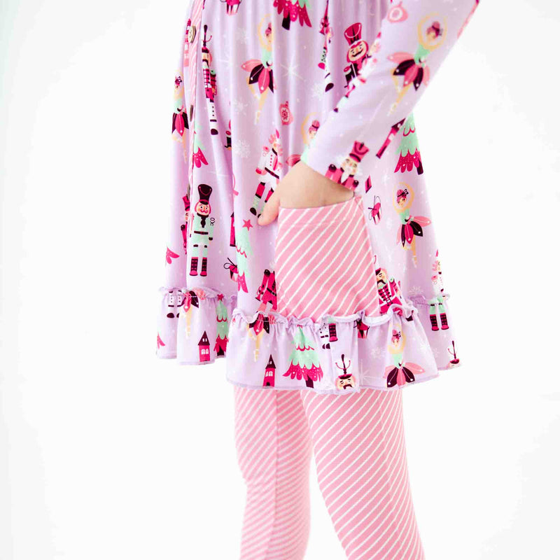 Showing pocket details on a tunic shirt. 