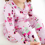 Close-up of pink nutcracker on pajamas. 