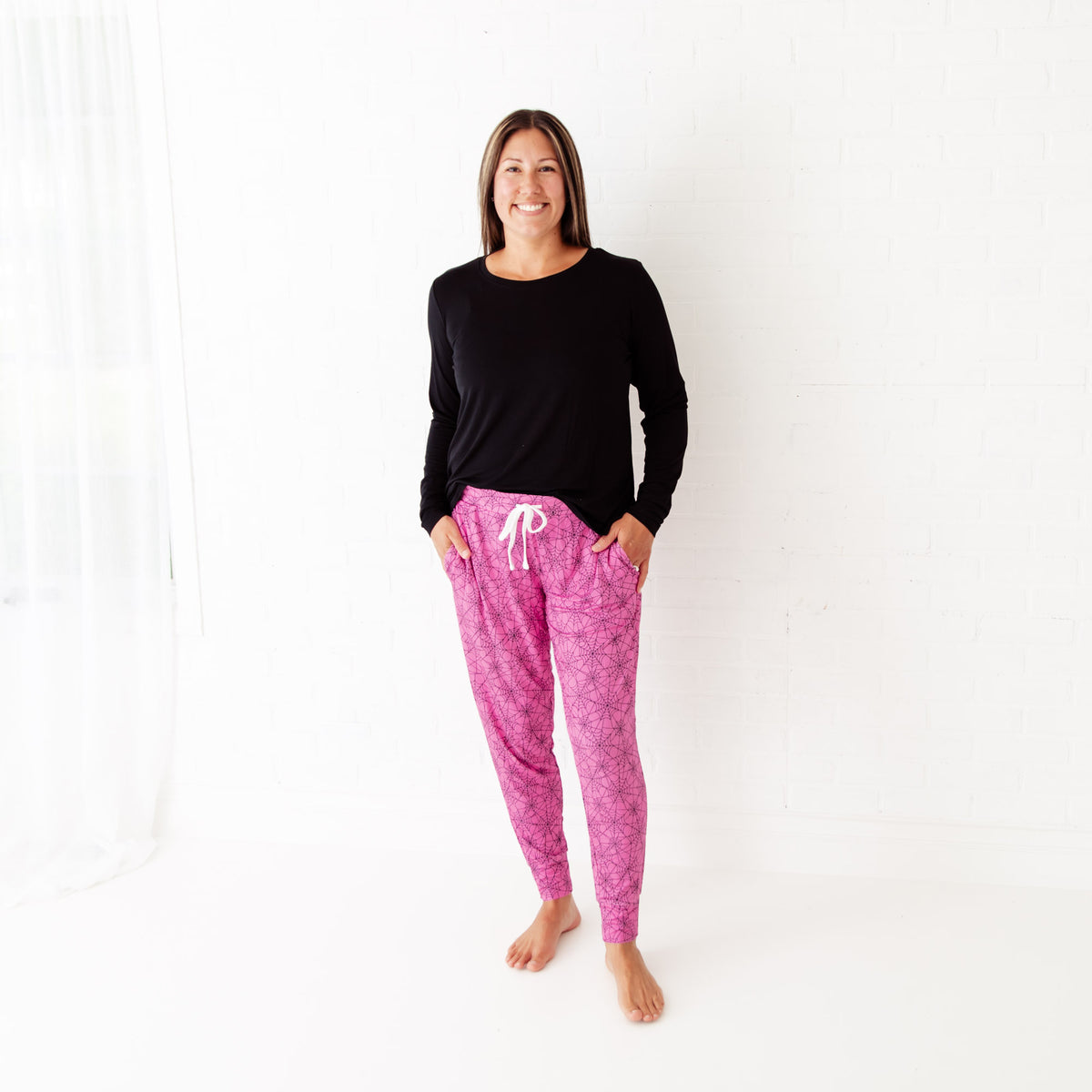 Women's loungewear featuring a pink spiderweb print from Dreamiere