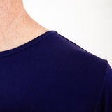 Shoulder of a navy blue shirt. 