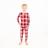Child wearing red and blue pajamas. 