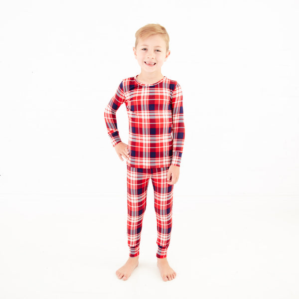 Child wearing red and blue pajamas. 