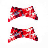 Red plaid holiday pigtail bows. 
