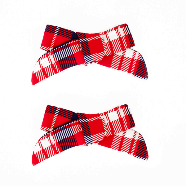 Red plaid holiday pigtail bows. 