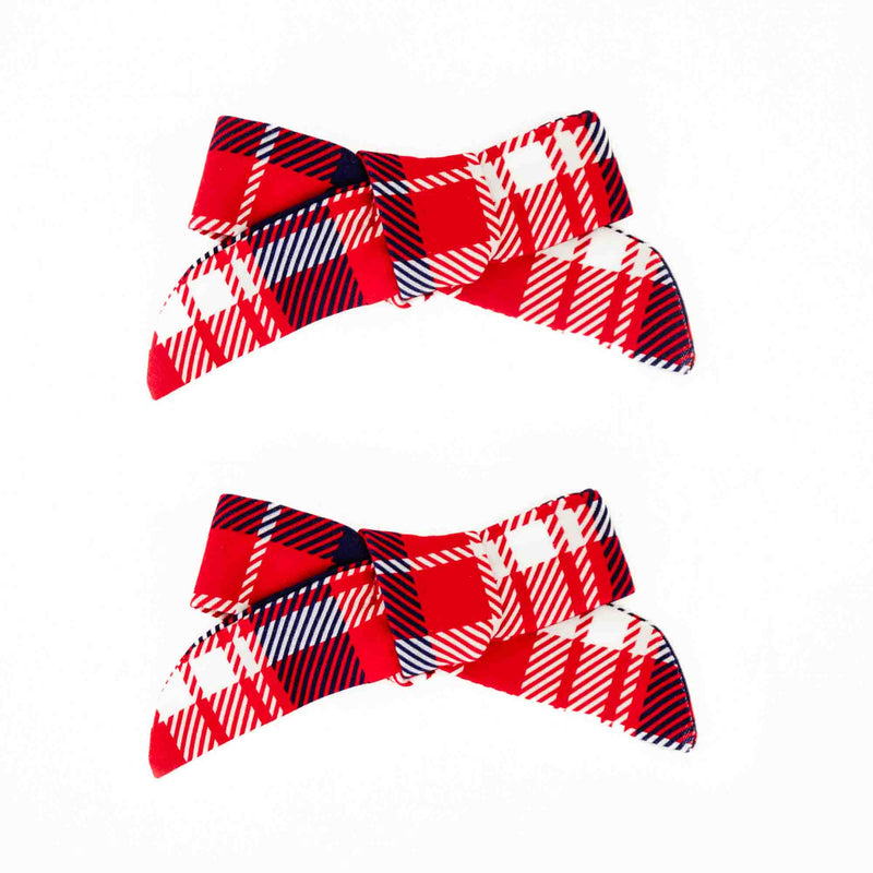 Red plaid holiday pigtail bows. 