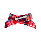 Back of a red plaid holiday bow. 