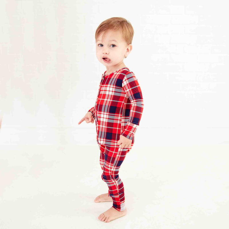 Child wearing red Holiday pajamas. 