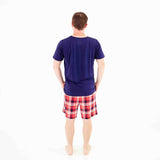 Man in plaid bamboo shorts pajamas. 