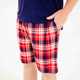 Close-up of red plaid pajama shorts. 
