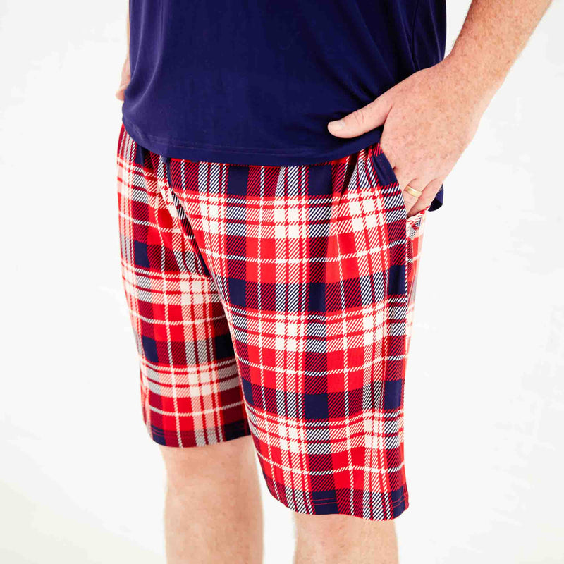 Close-up of red plaid pajama shorts. 