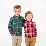 Boys wearing plaid polo shirts together. 