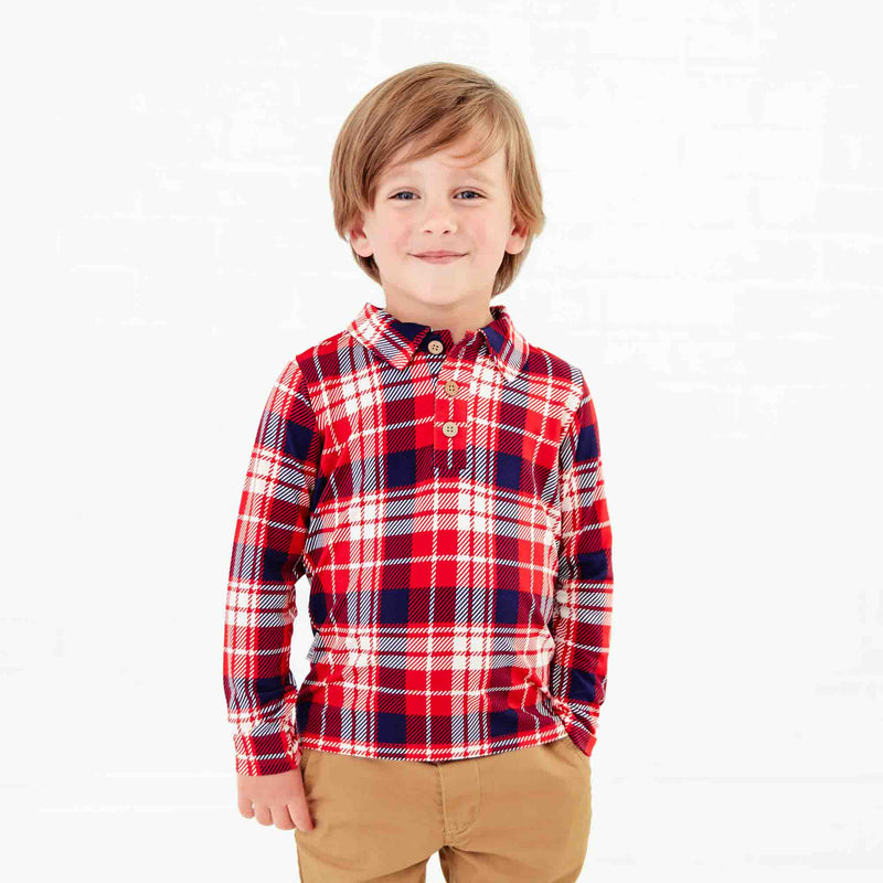 Boy in a Red plaid polo shirt. 