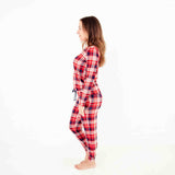 Woman wearing a red and blue plaid pajamas. 
