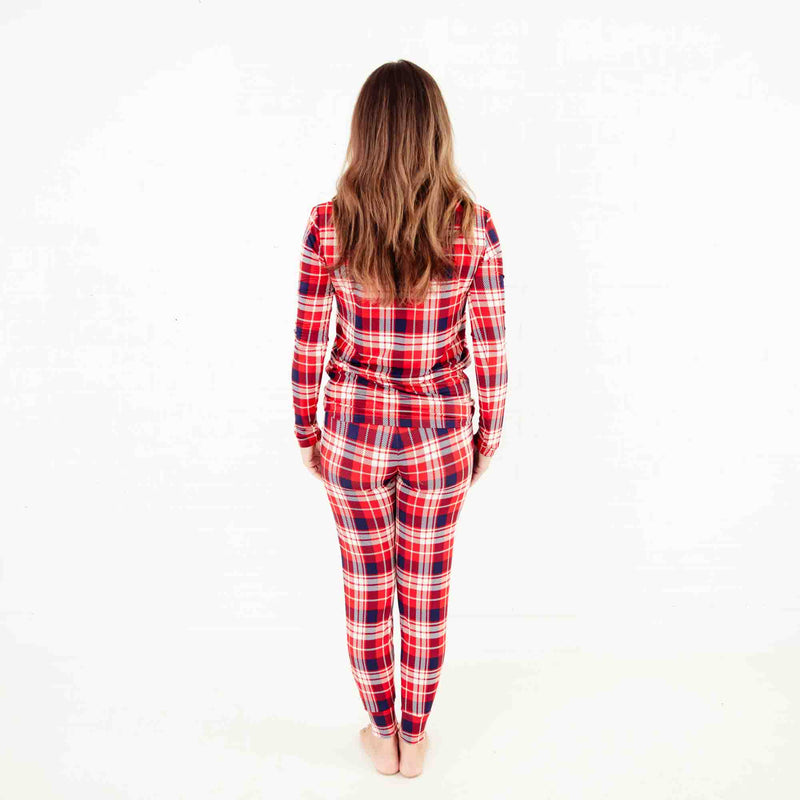 Woman wearing red plaid pajamas. 