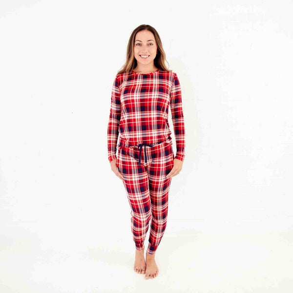 Woman wearing red plaid pajamas.