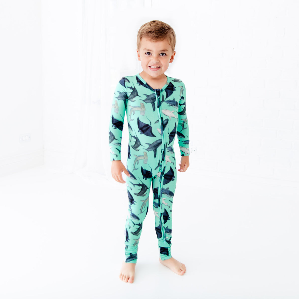 Convertible baby footie with playful shark pattern by Dreamiere