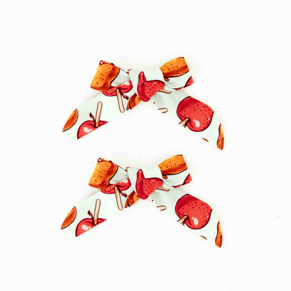 Set of bows with a caramel apple print. 