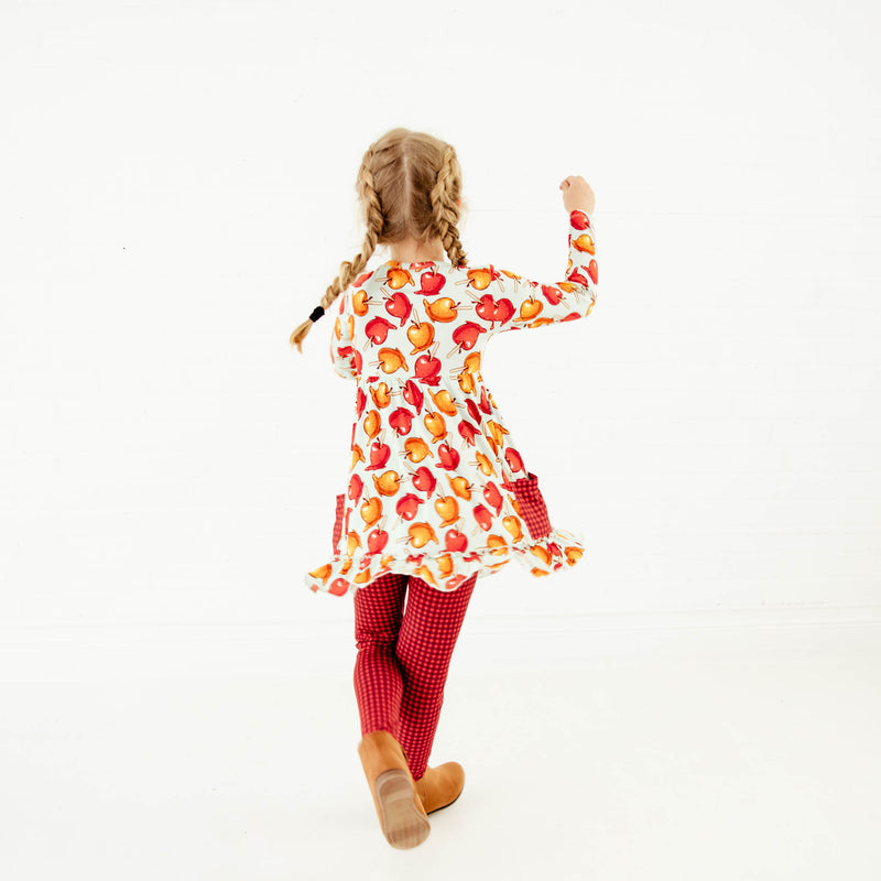 Girl dancing in fall outfit. 
