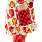 Close-up of a pocket on a girl's tunic. 