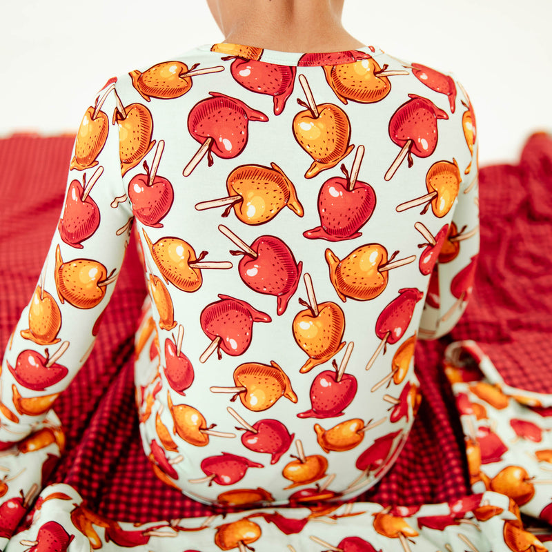 Close-up of caramel apple pajama print. 