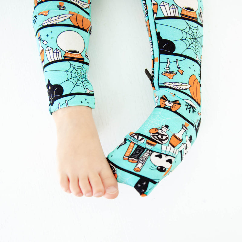 Child's feet showing convertible footie pajamas. 