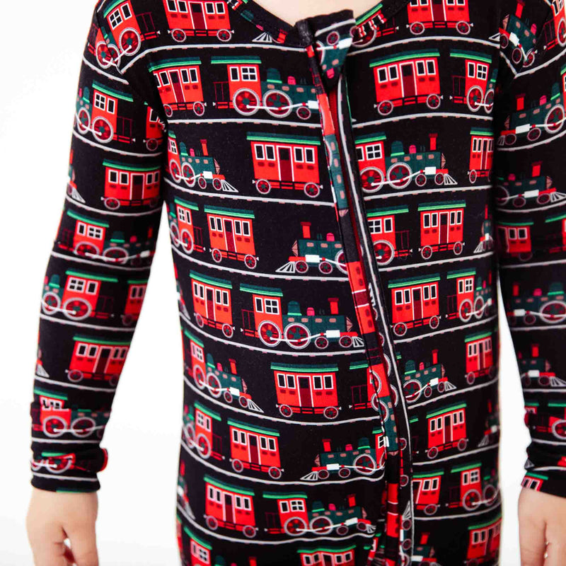 Close-up of train print pajamas. 