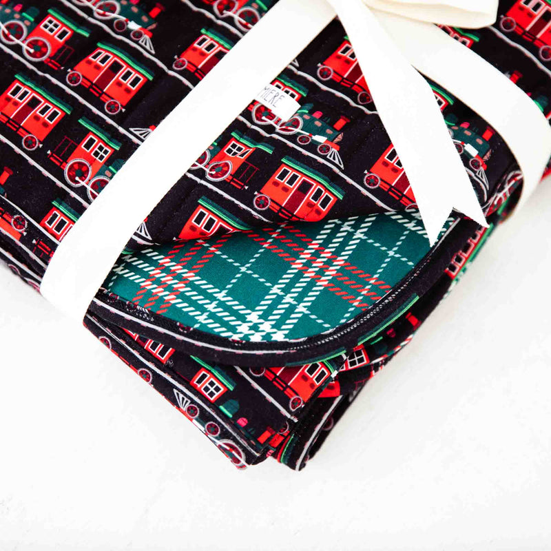 Close-up of reversible holiday blanket. 