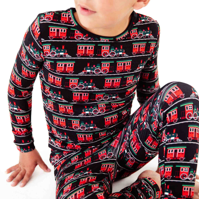 Close-up details of train print on pajamas. 