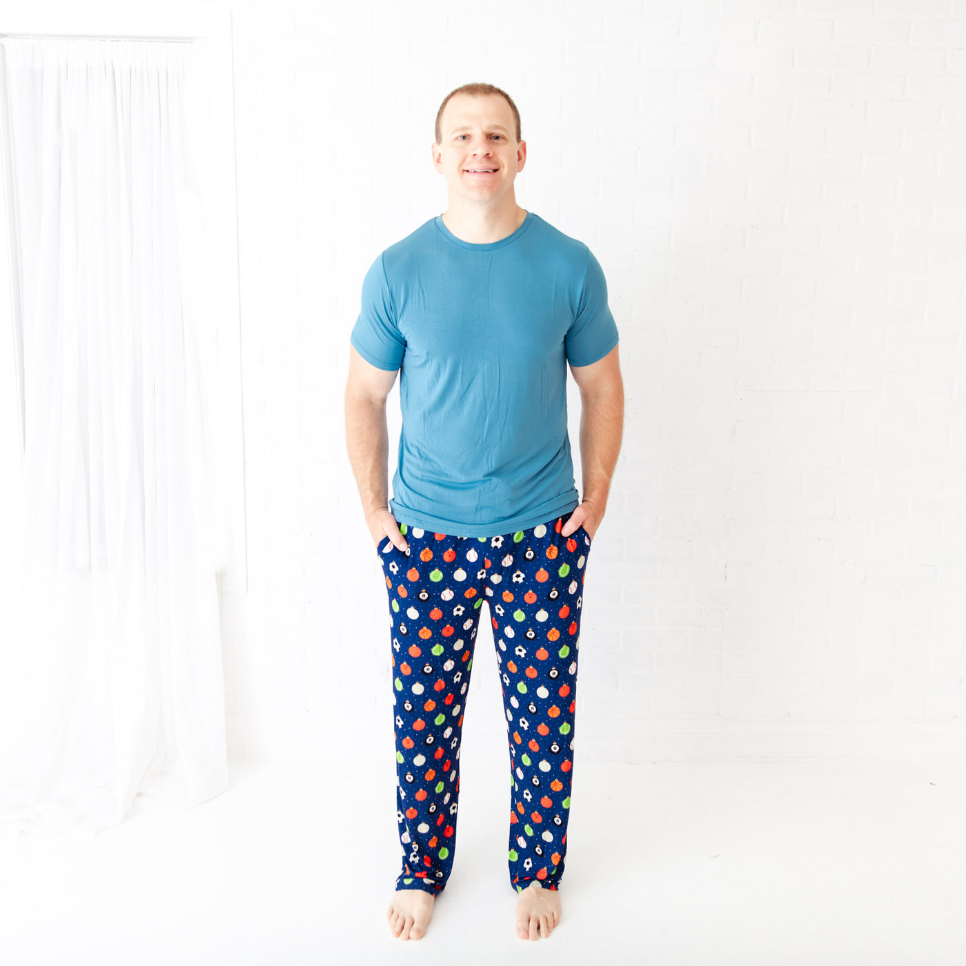 Festive men’s loungewear set with red shorts and themed top